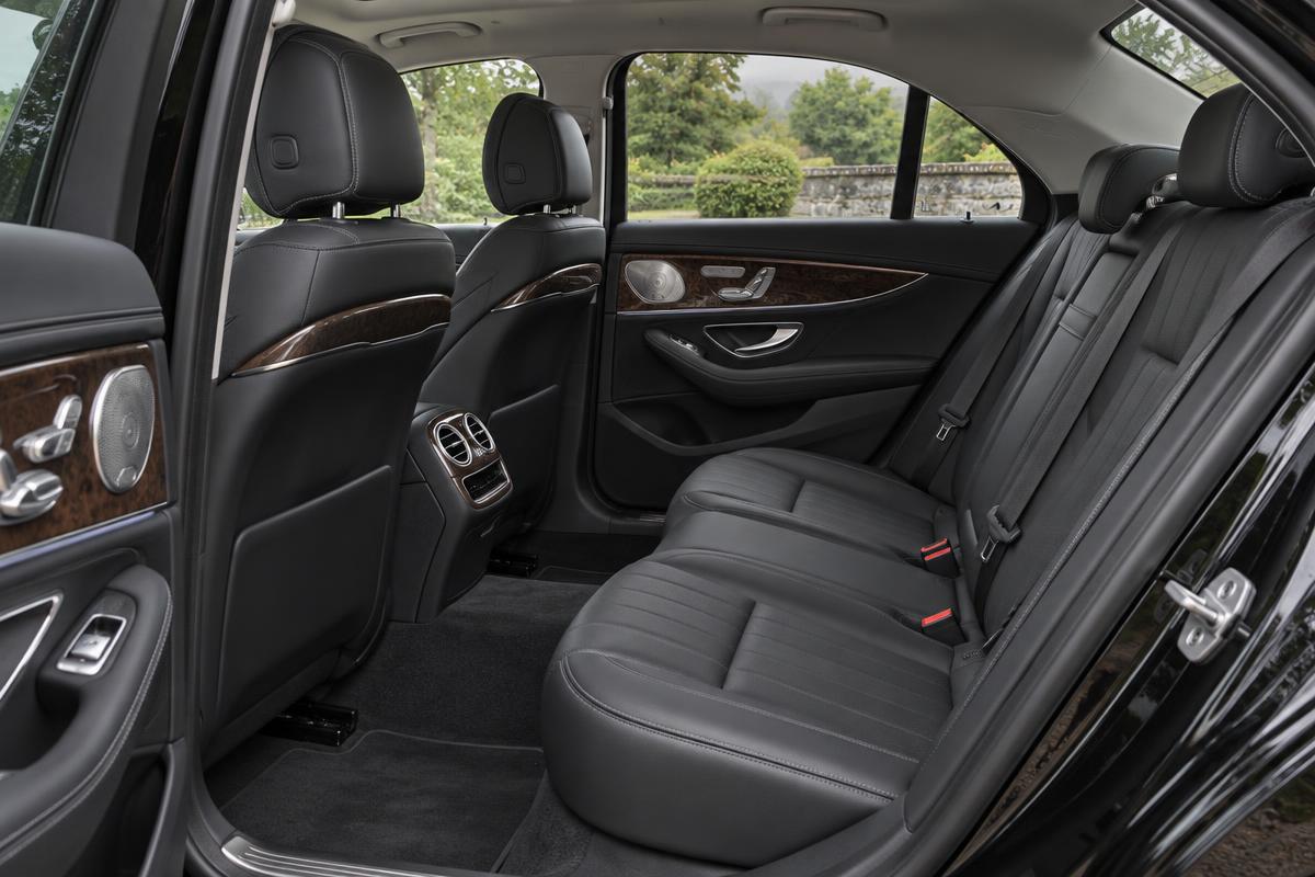 Illustrative scene: Spacious executive saloon rear cabin with stitched leather and wood trim